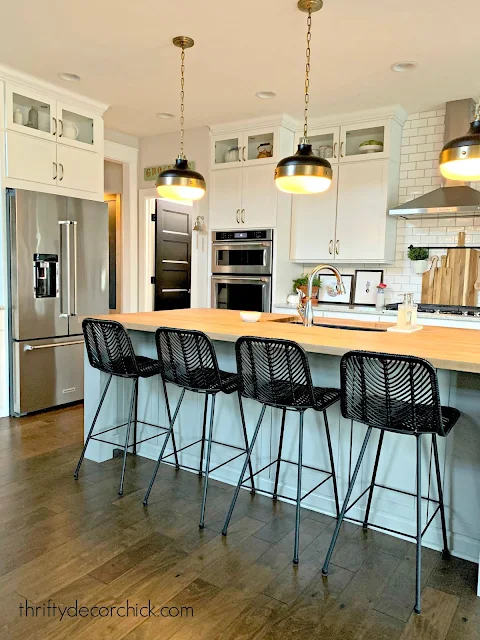 white kitchen gray island black doors