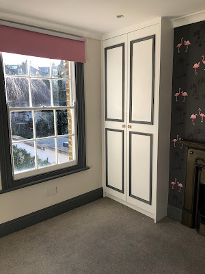 window and floor-to-ceiling cupboard