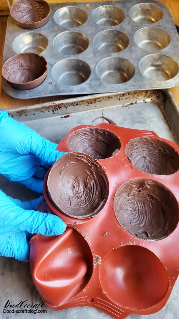 Step 1: Chocolate Mold  Begin by melting the chocolate melts and stirring them smooth with spoon. Do not overheat melts.   Then use the pastry brush to paint a layer of chocolate inside each of the silicone mold domes.    Freeze them for 5 minutes and then repeat by painting a second layer of chocolate on each dome. Freeze again.    12 domes will make 6 ice cream bombs.