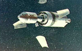 Panels moving alongside the spacecraft floating in free fall