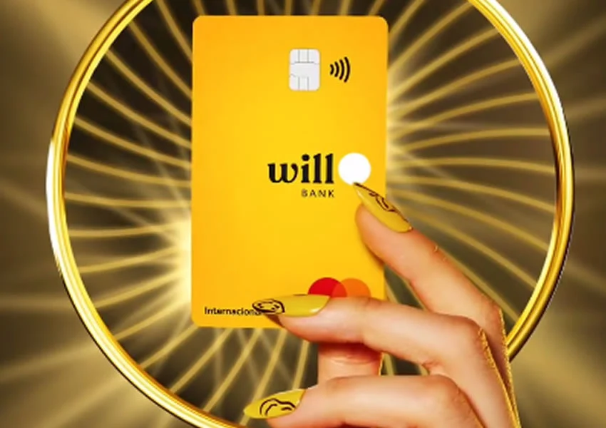 Mão segurando o cartão will bank