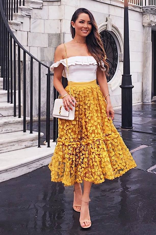 what to wear with a yellow midi skirt : heels + white bag + off shoulder top