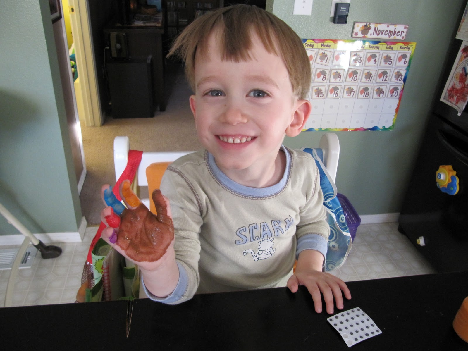 ... loaded the paint onto his hand, then he pressed it onto a paper plate