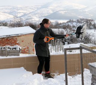 A gets started shoveling the snow