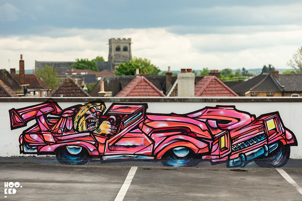 Mural work by graffiti artist Tizer of a Yeti character driving a car painted in Penge, London.