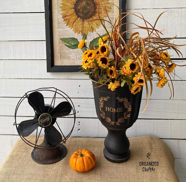 Photo of a DIY black urn with fall decor
