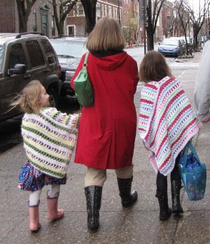 woman and children walking on street