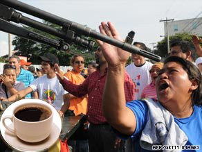 Protestors confront military police outside the presidential palace in Tegucigalpa. Inset:Serving suggestion for a cup of Honduran coffee