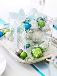 colourful candles in glass container Christmas table