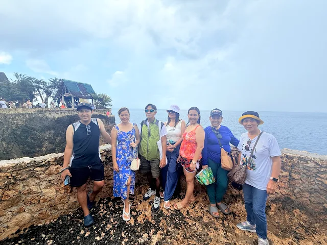 Tourists exploring Pitogo Cliff area