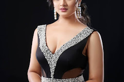 Komal more showed her hotness in black deep neck dress