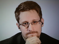 Putin grants citizenship to Edward Snowden, who exposed U.S. surveillance.