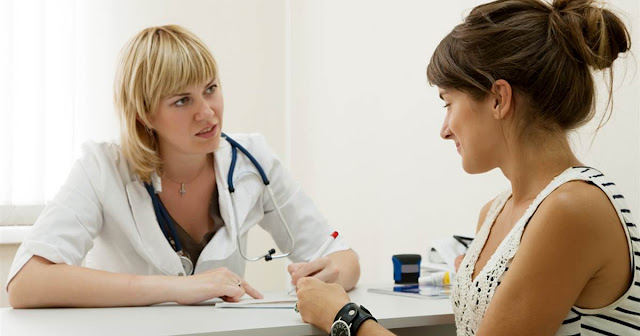 Female Doctor Offering Treatment Options for Cervical Cancer to Patient