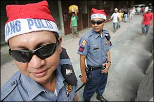 Police officers wearing Santa hats