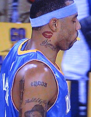 Kenyon Martin rocks the neck lips tattoo pretty hard.