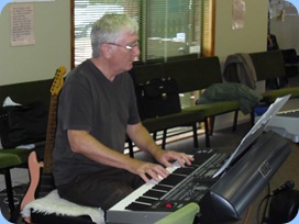 Gordon Sutherland playing his Korg Pa3X and propped-up by the electric guitar! Photo courtesy of Brian Gunson.