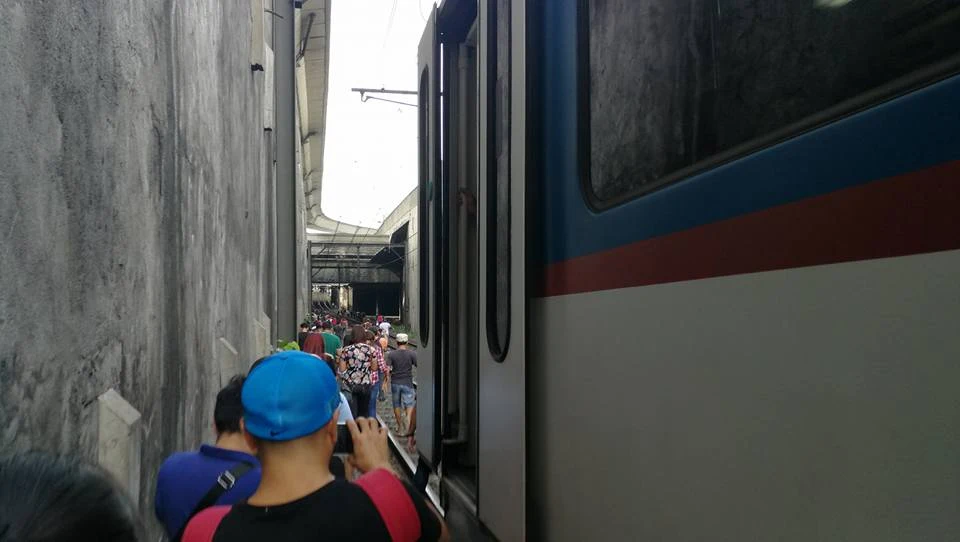 Passengers walk to station after MRT train detaches