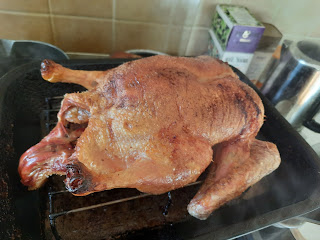proud roast duck awaiting carving