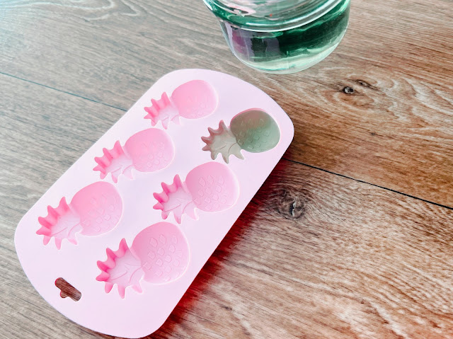 pouring melted wax into silicone mold for wax melts