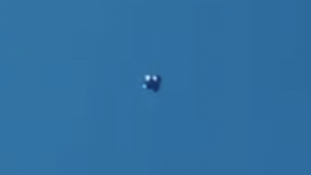 Here's a silver metallic UFO sighting over Calgary Alberta in Canada with lights slowly turning on and off.