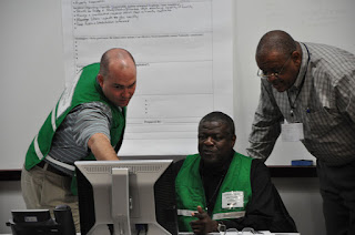 Correctional leaders from across the country confer during a simulation involving Texas prison during a hurricane.