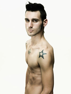 Star Tattoo Black shoulder star tattoo on good looking male's.