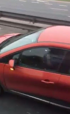 Disgusting moment commuter filmed horny driver masturbating behind the wheels of his moving car on a MOTORWAY on the Westlink road in Belfast, Northern Ireland.  The graphic footage was uploaded to a private Facebook group by local Steven Larmour, who says it was shared with him and he is unsure of the origins.