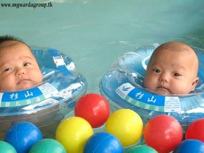 Funny Babies Bathing In Swimming Pool