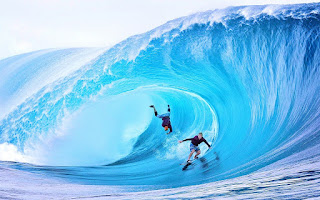 Who holds the record for the highest wave ever surfed, and how tall was the wave?