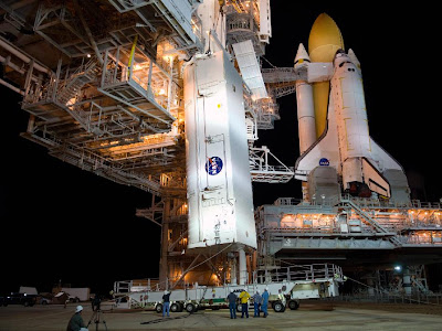 Payload canister is delivered to Launch Pad 39A where space shuttle Atlantis stands
