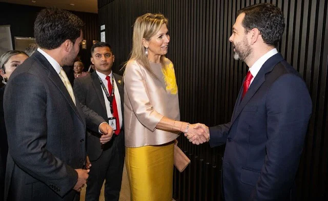 Queen Maxima wore a beige silk satin top by Natan, and a yellow satin skirt by Natan. Spring Summer 2018 collection