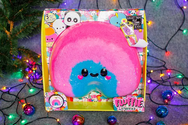 A pink and blue rainbow Fluffie Stuffiez plush toy