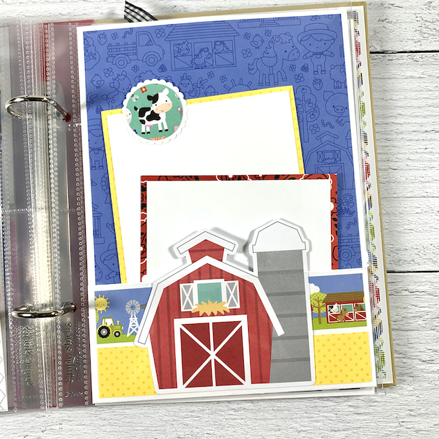 Down on the Farm Scrapbook Album page with a pocket, a barn, and a cow