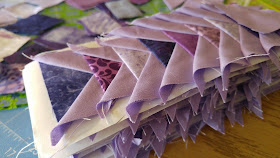 purple tiny paper pieced flying geese triangles