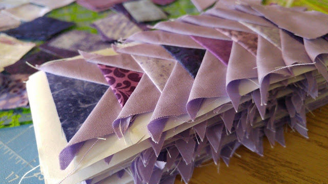 purple tiny paper pieced flying geese triangles