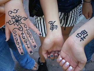Beauty women with Henna Tattoos on hand