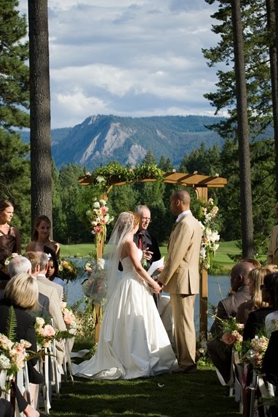 The wooden wedding arch was embellished with simply a few lush clusters of 