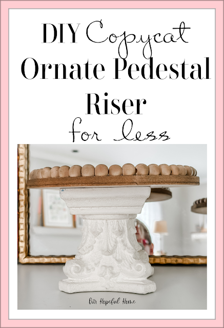 ornate white pedestal riser with wood plate