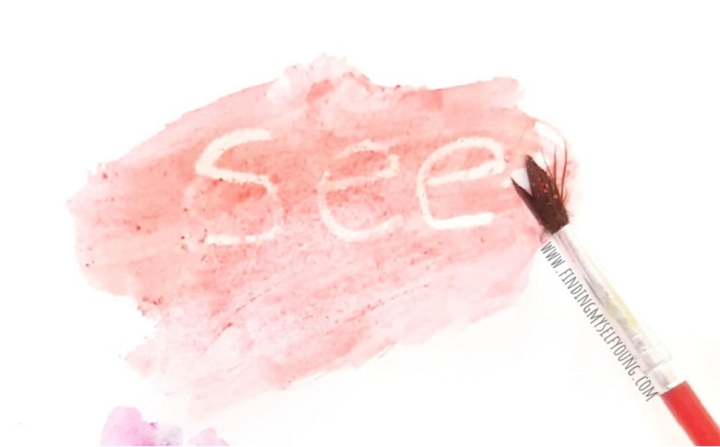 crayon resist painting reveals the word see