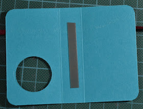 add small amount of double sided tape to the inside spine