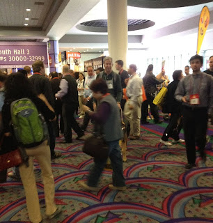 Mike in the sea of CES attendees, navigating with his guide dog Tank