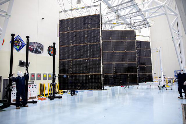 One of the Europa Clipper's twin solar array wings is deployed inside the Payload Hazardous Servicing Facility at NASA's Kennedy Space Center in Florida...on March 6, 2024.