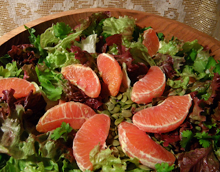 Sunburst of Orange Sections on Greens