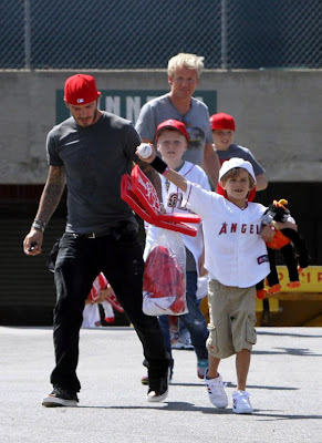 David Beckham and his family playing in the park Pictures