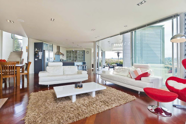 Photo of white and red furniture in the living room during the day