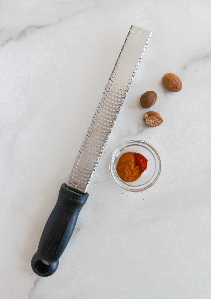 grating whole nutmeg with microplane