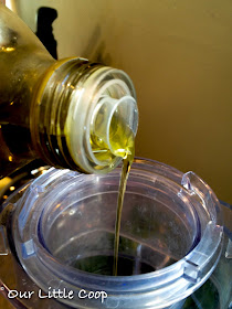 basil and olive oil in food processor