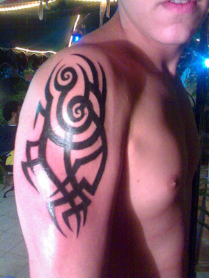 tribal cross arm tattoos. at 3:43 AM