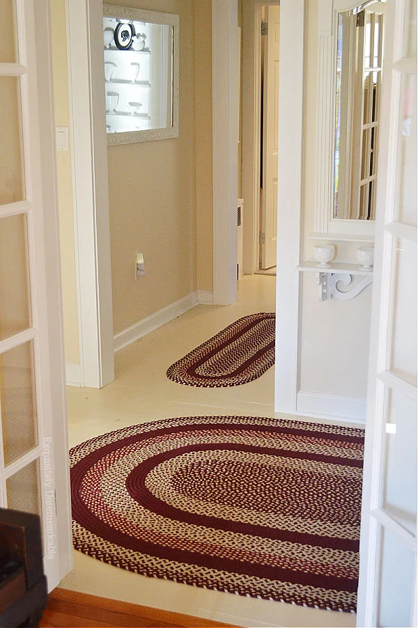 Red Braided Rugs In The Hallway