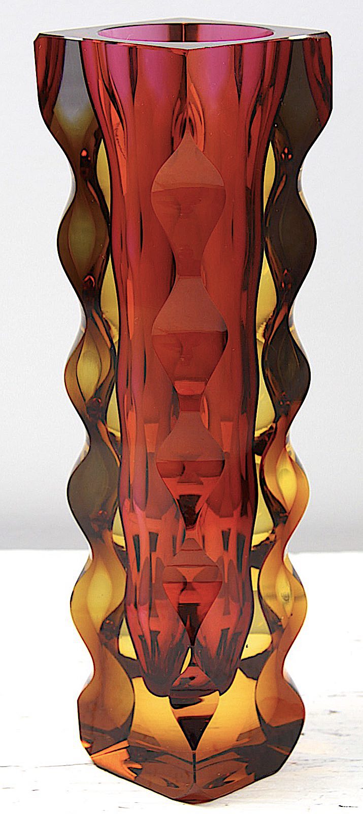 an Exbor glass vase in orange and amber 1964